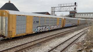 CSX 948 (ES44AH) leads empty Autoracks westbound past Martinsburg Roundhouse.
