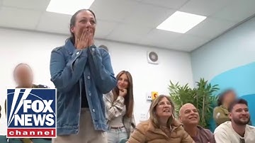 Wife of Hamas hostage jumps for joy watching release