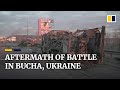 Burned-out military vehicles and destroyed shops after battle for Bucha on outskirts of Kyiv