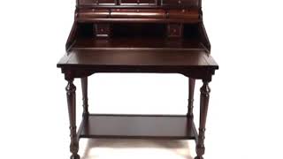 https://colemanfurniture.com/canthus-cherry-secretary-desk.htm This traditional style secretary desk has a fold-out writing tray 