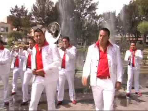 Watch the video for Me Duele Tu Nombre