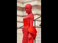 Doja Cat is unrecognisable covered in red crystals at Schiaparelli fashion show