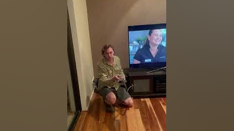 Australian Snake Catcher Removes Carpet Python From Behind TV Set