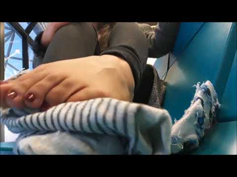 Lenora Taking off Double Socks at Airport