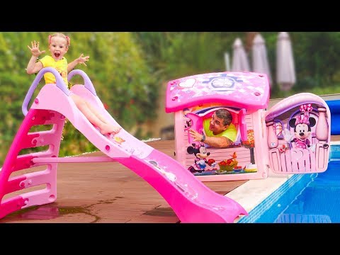 Stacy and dad play with a water slide