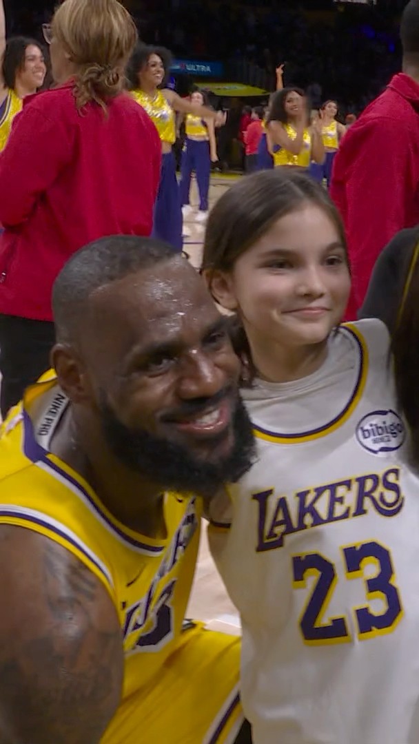 LeBron with a young fan after the game!