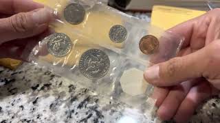 Searching proof sets for coins to grade.