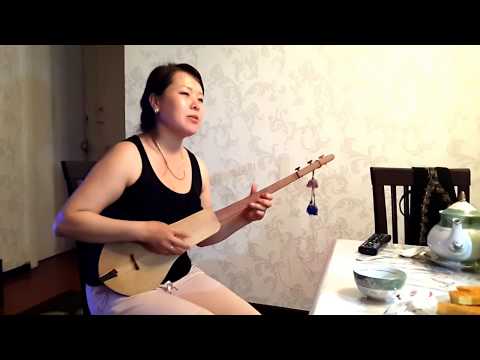 Beautiful Singing Kyrgyz Woman Entertains with Komuz with National Instrument