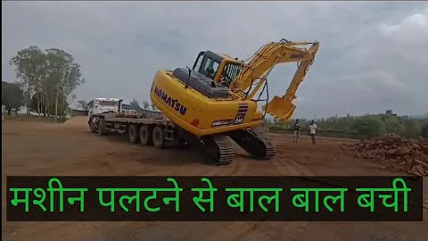 Excavator unloading from trailer.KomatsuPC210-10 newmachine.Excavator unloading without ram.#komatsu