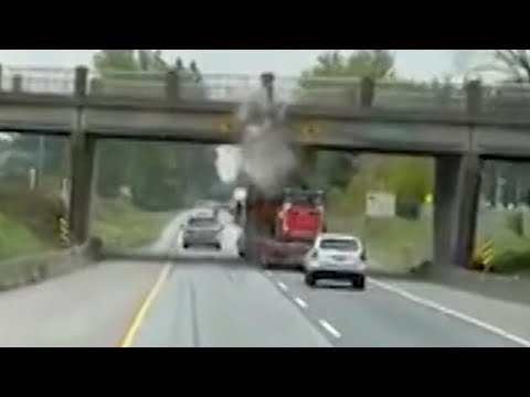 Loaded truck slams into highway overpass in British Columbia