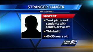 Police: Students say man took pictures of them at bus stop