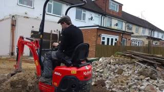 Using the 1 tonne kubota mini digger to back fill a trench