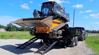 How to Safely Load and Haul a Skid Steer in a Dump Trailer