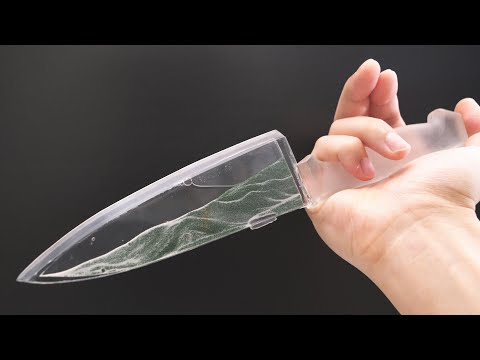 Kitchen knife made by cooking sand in a microwave oven