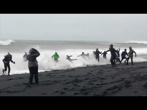 Waves Sneak Up Reynisfjara Beach in Iceland and Knock Over Tourists