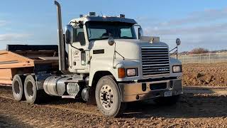 CAT D7E Dozer Working with Side Dumps & Belly Dumps