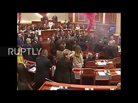 Albania: MPs shroud parliament in pink smoke in bid to halt elections