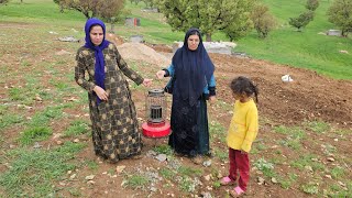 Sakina and her child's invitation in a heavy rain by Susan