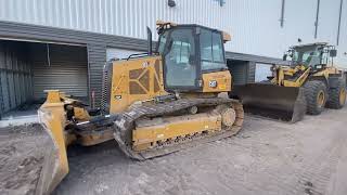 A cat bulldozer parked up for the day.