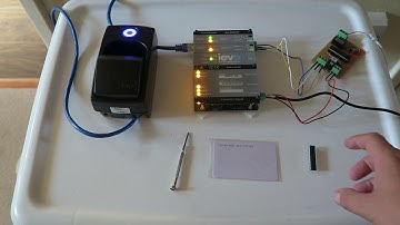 Use any Biometric reader that can output Wiegand to Set/Unset any alarm that has a keyswitch option