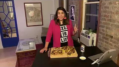 Julie Feltman eating and reviewing pizza