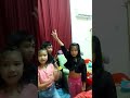 the three kids dancing while singing