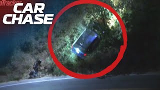 Police chase a stolen Minivan before it veers off a winding road into the trees