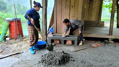 With their skillful hands, BINH and NGOC completed the construction of the stove at the new farm.