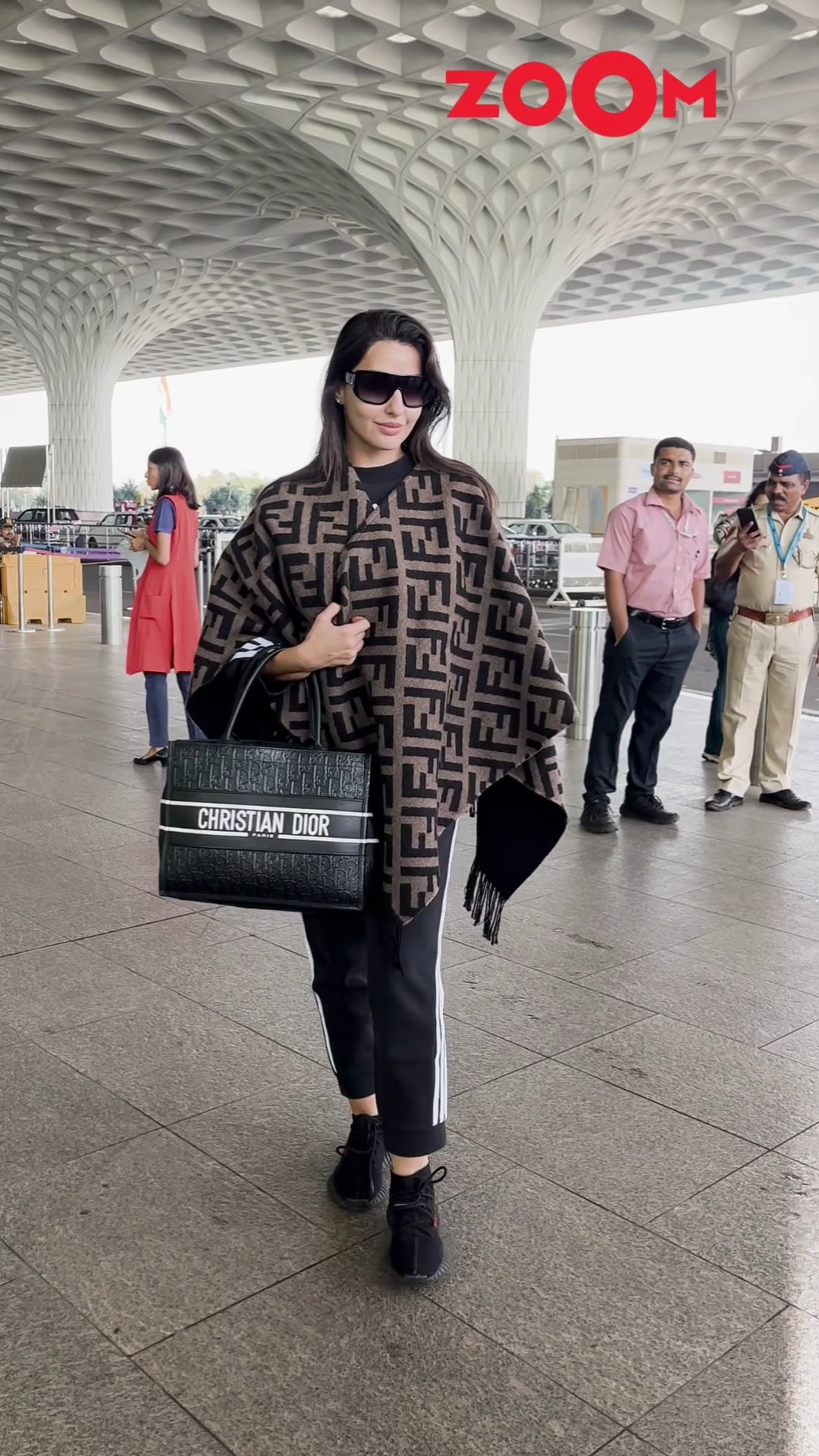 Nora Fatehi SWEETLY poses for the paps as spotted at the airport ? #norafatehi #shorts