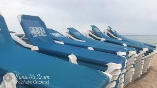 Benidorm Levante beach full of sun beds on a cloudy day - 16 June 2021