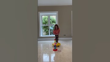 Scooter board and ring toss game. Balance, motor planning, throwing accuracy skills, concentration