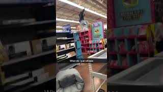 Guy jumps off shelves at Walmart into Barbie sign