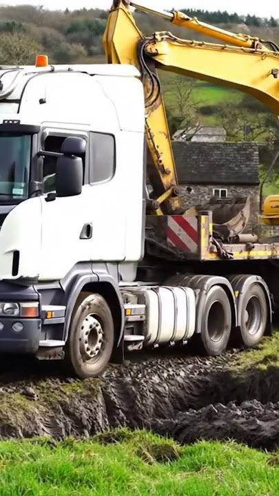 Scania Truck transporting an excavator across the muddy field #automobile #truck