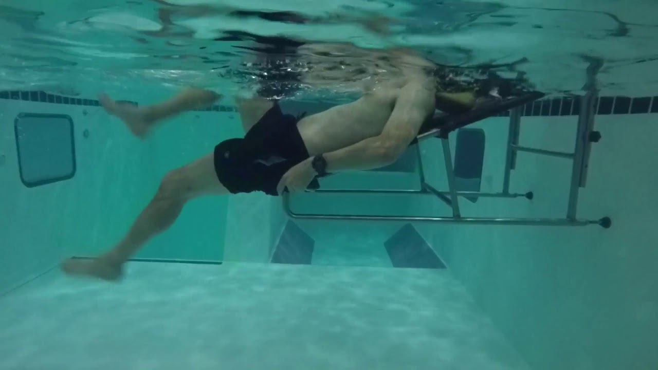 A patient exercising in the pool who suffers from Low Back Pain YouTube