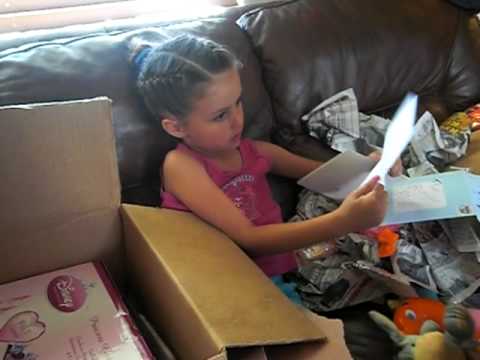 "Kennedy opens up her birthday present from the Wo...