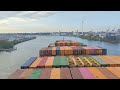 Departure of large container vessel from the port of Hamburg, time lapse, no audio.