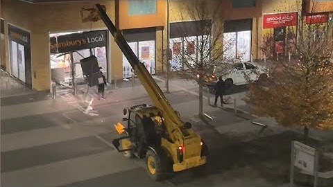GANG USES DIGGER TO RIP ATM FROM SAINSBURY