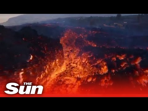 Drone flies through eye of La Palma's raging volcano in stunning footage.