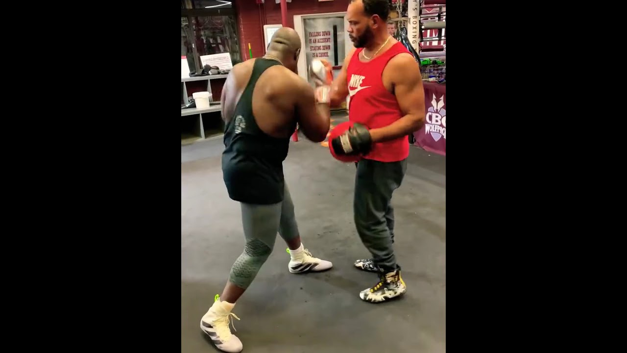 THROWING POWER UPPERCUTS WITH BOXING PADS