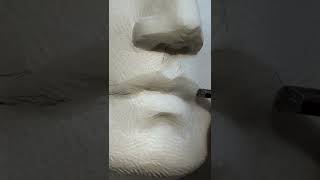 Carving a mouth in marble