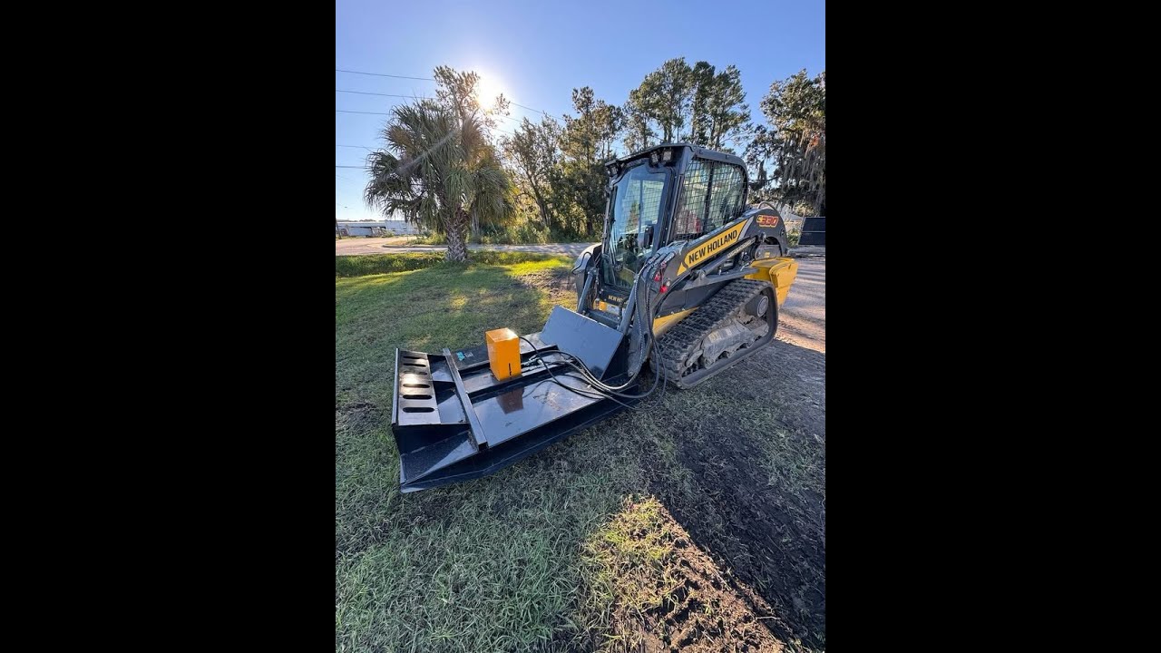 Changing attachments on a New Holland 330 Skid Steer