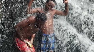 Village Boy Having A Bath Underwater Fall