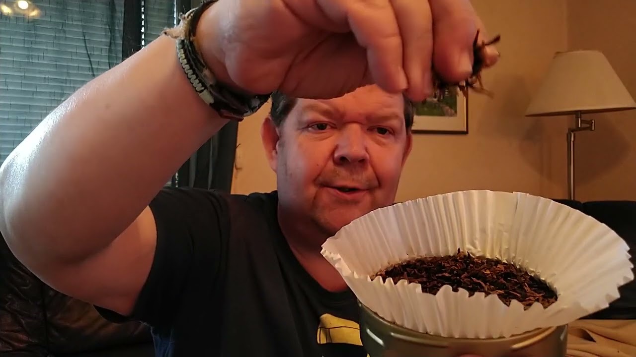 Chatt and open a old tin Dunhill