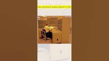 Man operating an analog computer in 1962