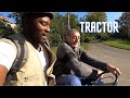 Riding Through A Village On Tractor