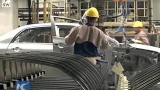 Toyota posts record net profit in Q2 thanks to robust sales, yen's depreciation