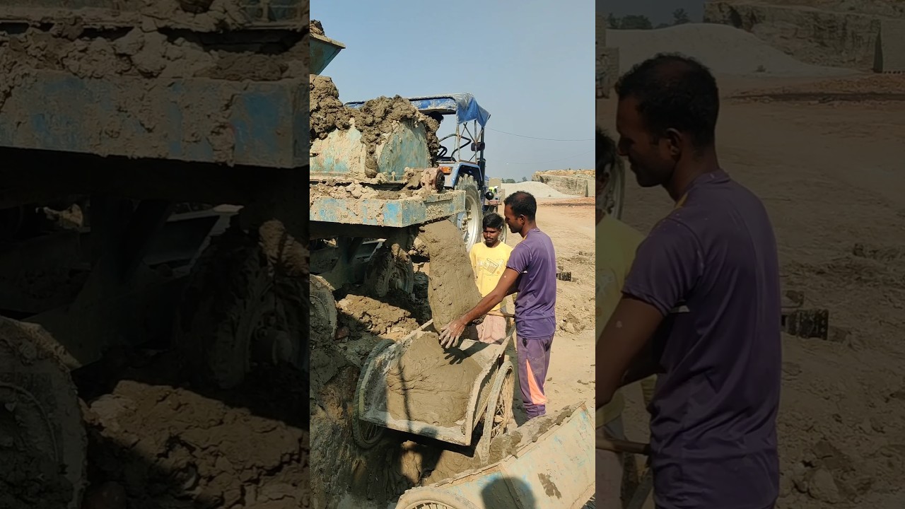 JCB is Cutting the mud And tractor machine unloading strong soil 