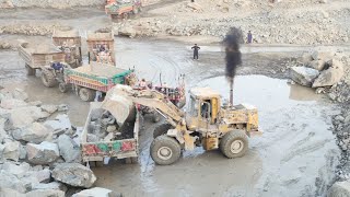 Big Rock Loading Machine in Action: Caterpillar 966F Loading Huge Rocks into Dump Trucks & Trolleys