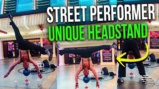Street Performer Pulls a Headstand on a Ball That’s Placed on Top of an Upside Down Glass