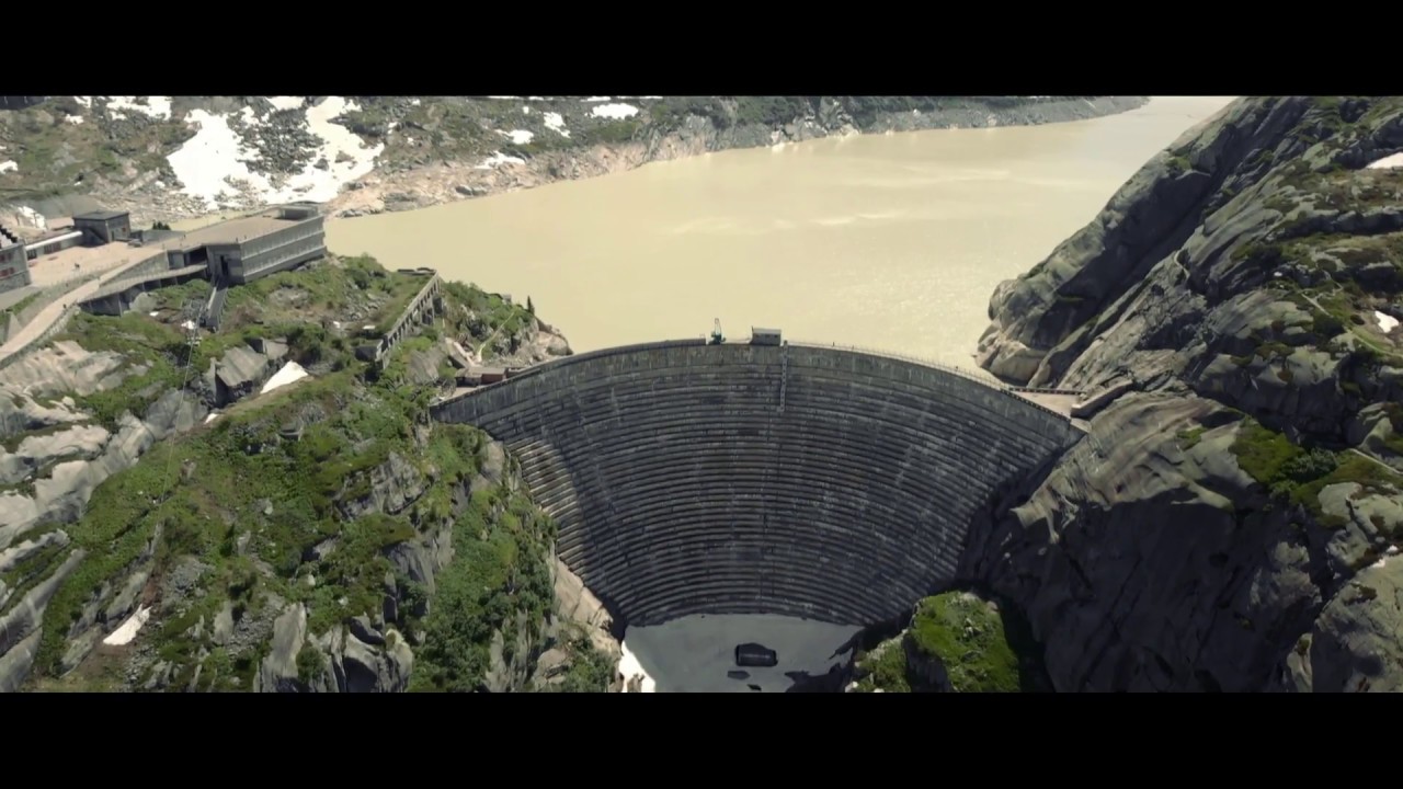 Cinematic drone view of Grimsel Pass Dam and Hospiz
